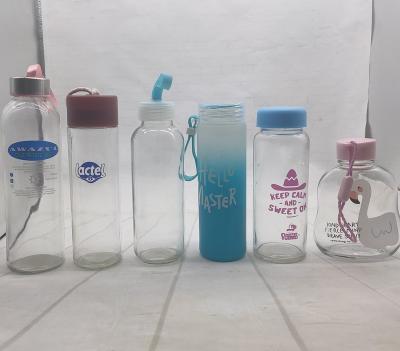 China Beverage Customized Logo Glass Water Bottle Clear Water Bottle 16oz 18oz 500ml With Stainless Steel Cap for sale