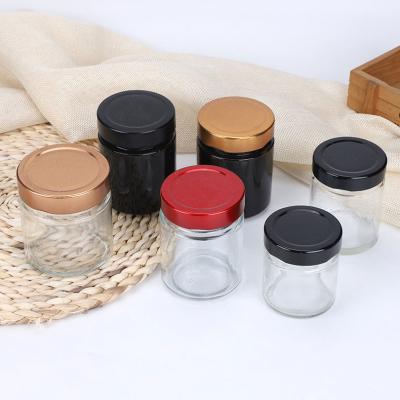 China 50ml 80ml 100ml 180ml Amber Spice Stocked Honey Glass Bottle Storage Jar With Metal Cap for sale