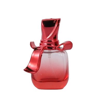 China GIFT Wholesale 39*27*72 Customization Perfume Bottle Empty Red Glass Spray Bottle With Bowknot for sale