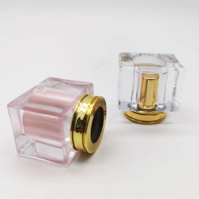 China ODM Strict Custom Made Luxury Acrylic Square Smell Proof Quality Control Gold Perfume Bottle Transparent Gold Perfume Bottle Lids for sale