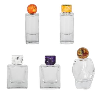 China Customized Unique Luxury Materials Fashionable High Quality Smell Proof Resin Smell Proof New Round Caps For Perfume for sale