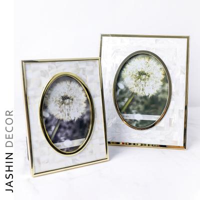 China Luxury Home Decoration Light Shell Photo Frame Living Room Bedroom Metal Picture Frame for sale