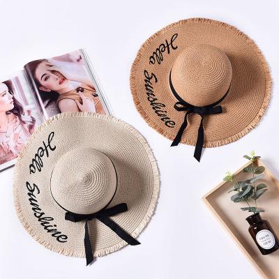 China New summer high quality large lady beach straw hat gutters embroidered letter rough brim sun hat for sale