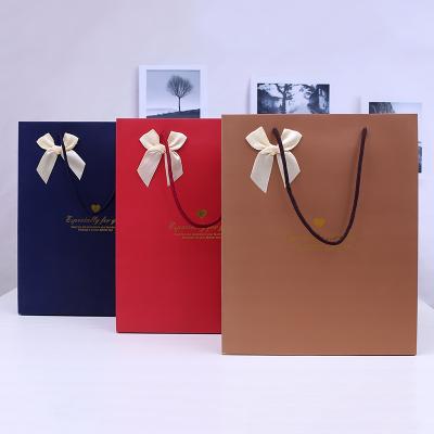 China Environmental protection recyclable custom clothing bag ivory board kraft paper quality portable shopping gift bag customization for sale