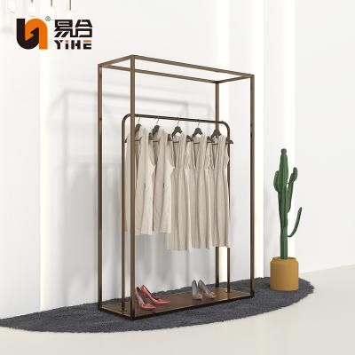 China Customized Luxury Women Clothing Store Gold Clothes Double Decker Display Racks For Clothing Boutique Store for sale