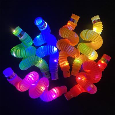 China New Silicone Glow in the Dark Wiggle Person Toys Telescopic Tube Toys LED Sensory Plastic Tubes for sale