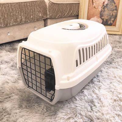 China Breathable Pet Cages Carriers Large Size Stable PP Made Pet Flight Case Suitable For Travel Outdoor Breathable Pet Cages Carriers for sale