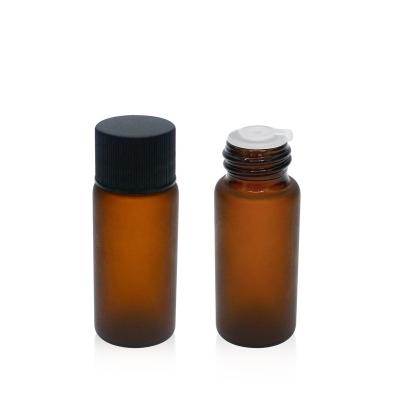 China 10ml cosmetic amber frosted glass bottle with black screw cap for sale