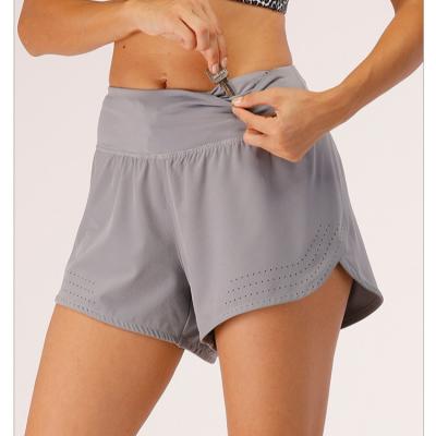 China Breathable Women's laser cut breathable Workout Running Shorts with Pockets 2 in 1 shorts with buikd in  Lining gym Athletic Yoga Shorts for sale