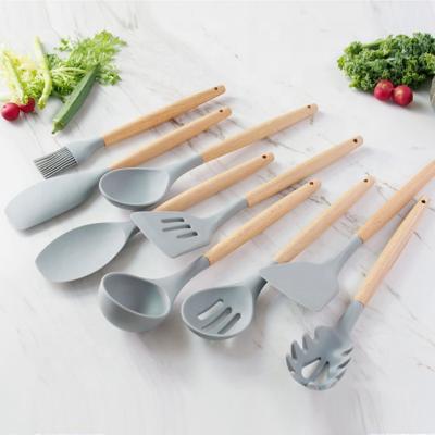 China Sustainable 9 Piece Silicone Kitchen Cookware Premium Set Wooden Rack Kitchenware Set Gray for sale