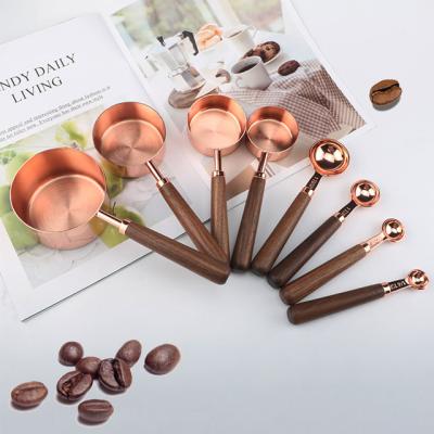 China Amazon Hot Selling Viable Black Walnut Handle Wooden Measuring Cup And Spoon Set Stainless Steel Measuring Cup Set for sale