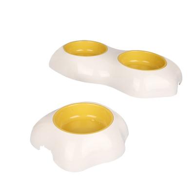 China Sustainable Slow Eat Dog Feeder Water Bottle 2-in-1 Yellow Food Feeder Training Anti-Clog Slow Feeder Bowl for sale