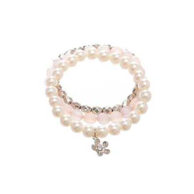 China New Design Hot Selling Pink Ivory Beaded Ivory Beaded Silver Beaded Elastic Bracelet With Delicate Flower Charm for sale