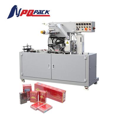 China Food film packing machine bopp film packing machine cosmetics packing machine for sale