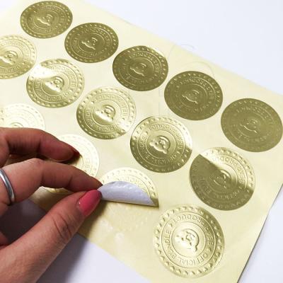 China Good Quality Embossed Gold Foil Sticker Die Cut Adhesive Custom Embossed Metallic Silver And Gold Foil Logo Stickers for sale