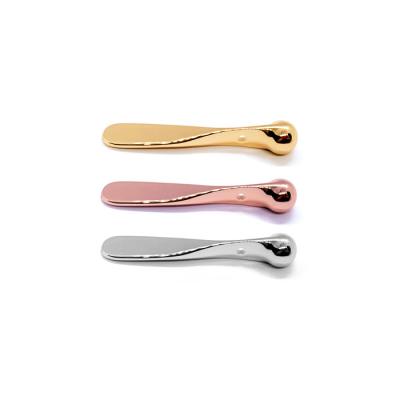 China Fastest Delivery Texture Metal Spatula Mini Cosmetic Scoop Eye Massager Applicator Eco Cosmetic Zinc Alloy Stick Luxury Gold Cream for sale