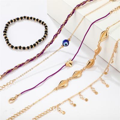 China New Bohemian Environmental Friendly Blue Eyes Rope Anklet Set 6 Pieces Fashion Indian Gold Shell Tassel Anklet for sale