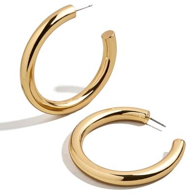 China 2021 exaggerated c-shaped women's environmental friendly brass plated nc earrings real gold metal cold style earrings for sale