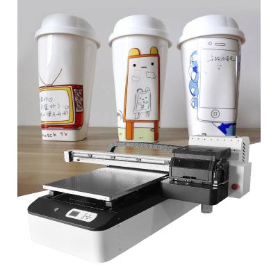 China Garment Shops 6090 Phone Case Printing Machine Digital UV Printer for sale