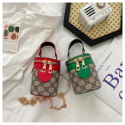 China New Portable Simple Printing PU Spring Bucket Bag For Handheld PU Bag Women Cylinder Cross Body Soft Bag Mini Small Clip Handbags for sale