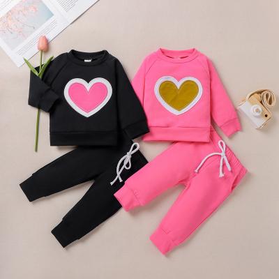 China Solid Color Valentine's Day Girls List Plug Anti-Shrink Solid Top Anti-Shrink Long Sleeve Sweater Pants Casual Set for sale