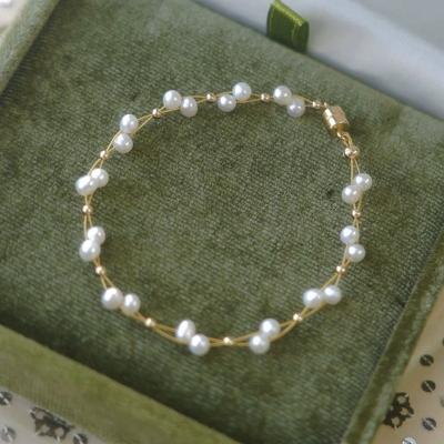 China FASHIONABLE Wholesale Natural Freshwater Pearl 14K Gold Bracelet Hand String Suction Buckle Lace Female Baroque Pearl Hand String for sale