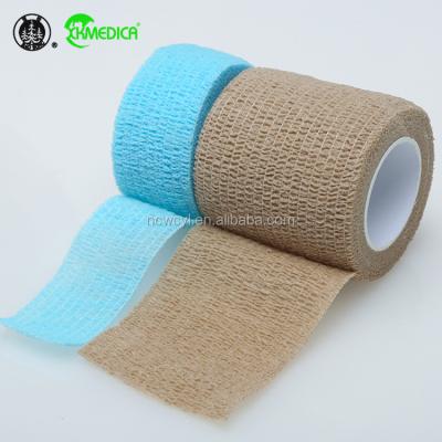 China 100% good selling non woven cohesive bandages 10cm 10cm X 4 5mt kraft paper wrap with latex dinoplast elastic adhesive bandage for sale