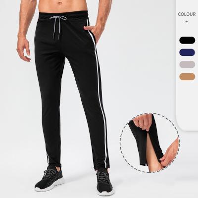 China Breathable Zipper Edge Contrast Drawstring Running Casual Men's Solid Color Pants Sports Gaiters for sale