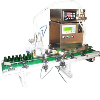 China Low cost 4 heads liquid filling machine mineral water alcohol glass water essential oil filling machine zu verkaufen