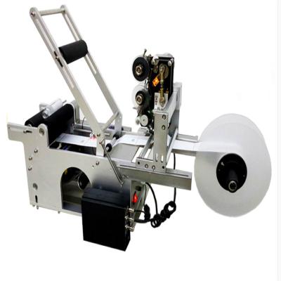 China Tabletop manual sticker labeling machine , adhesive labeling machine for round bottle for sale