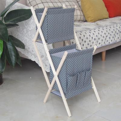 China Wooden Folding Shelf Storage Baskets Rack Use Clothes Storage Baskets Home Minimalist Modern Magazine Rack for sale