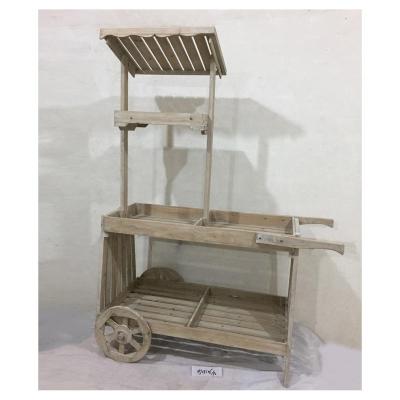 China Outdoor Rustic Standing Wooden Plant Display Rack Flower Pot Display Cart With Wheels for sale