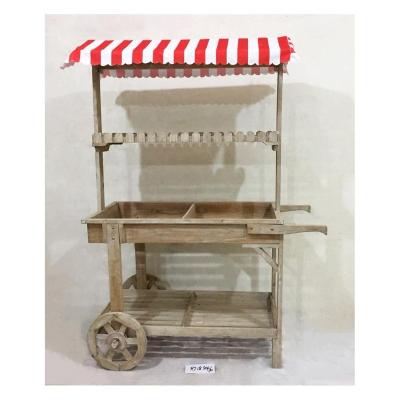 China Outdoor Decorative Wooden Planter Pot Display Rack Cart Flower Plant Pot Rack Display Stand with Wheels for sale