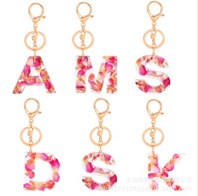 China 2021 English alphabet pendant gift petal resin letter charm key chain keychain English alphabet pendant key chain for sale