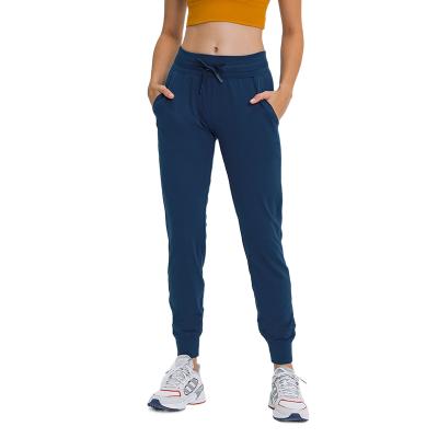 China Active Workout Yoga Fit Women Running Jogger Pants Loose Breathable Thick Comfortable QUICK DRY Gaiters With Pockets for sale