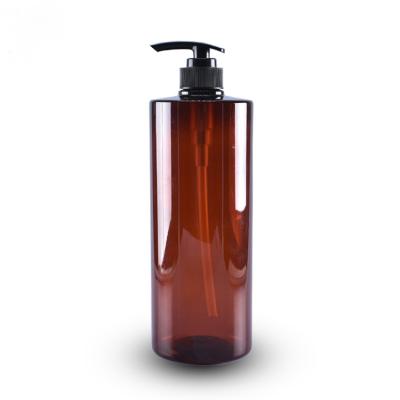 China Personal Care 1000ml PET Cylinder Amber 1 Liter Shampoo Bottle With Lotion Pump for sale