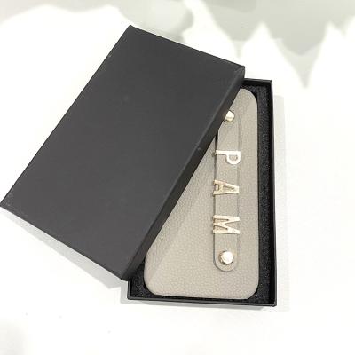 China parchute personalized name letter leather strap phone case with package for iphone 11 12 pro max for sale