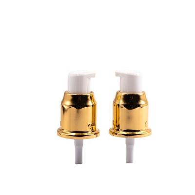 China Non spill 20mm 20/410 shinny gold lotion pump with caps for sale