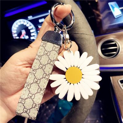 China Latest Design Sunflower Leather Custom Acrylic Key Chain Strap Genuine Leather Key Chain for sale