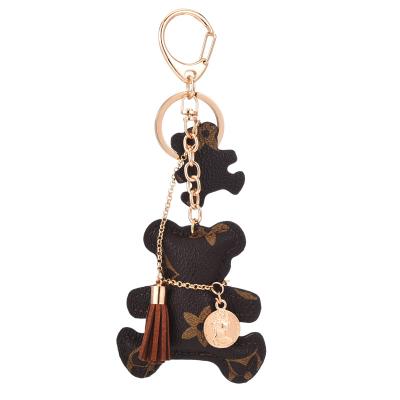 China Leather 2022 New Arrival Bear Key Chain Tassel Key Chain Cute Leather Bag Purse Charm Key Chain for sale