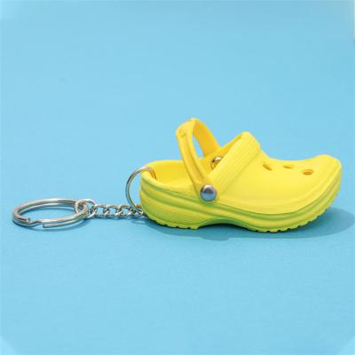 China New Design Plastic Soft Silicone Key Chain Wholesale Mix Colors Anime 3d Key Chain Foam Hole Croc Shoe Key Chain for sale