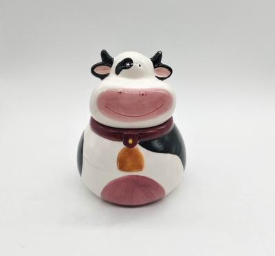 China Viable animal cartoon cow ceramic cookie jar with handpainting ceramic cow canister for sale