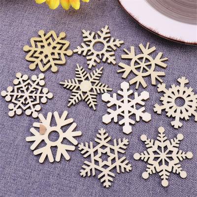 China Minimalist Christmas Snow Tree Decorations Wooden Hollow Pendant for sale