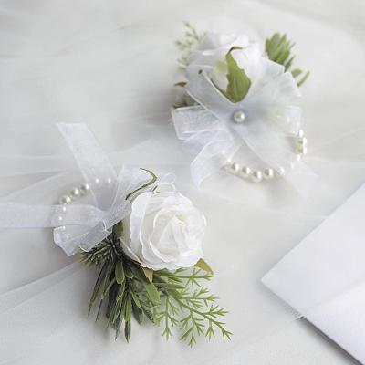 China Men's Ivory Corsage Rose Wrist Corset and Petticoat Wrist Strap Bracelet Set, Suitable for Wedding White Boutonniere Flower Accessories for sale