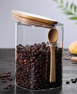 China Steamable 27 oz square glass jar with bamboo lid and spoon airtight clear glass canister for kitchen storage for sale