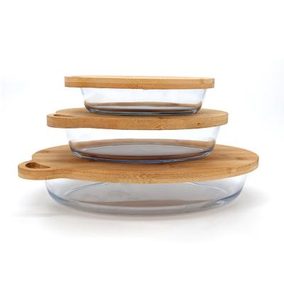 China 2400ML+3000ML+4000ML 3pcs Borosilicate Glass Bakeware Wholesale Oval Sustainable Heat Resistant Transparent Dish Sets With Bamboo Lids for sale