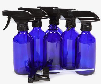 China Steamable 6 Large 8 oz Cobalt Blue Empty Glass Spray Bottles with Black Sprayers and Trigger Lids for sale