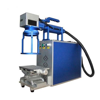 China Unbiased Fiber Handheld High Efficiency Portable Laser Marking Machine For Plastic Bottle for sale