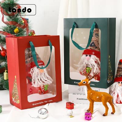 China New Design Handmade Tondo Christmas Gift Wrapping Paper Bag Christmas Shopping Bag With PVC Clear Window for sale