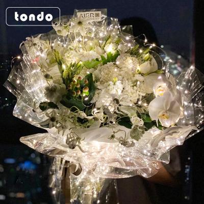 China Tondo Waterproof Star Bouquet Light Luminous Flower Wrapping Paper Packaging Cellophane for sale